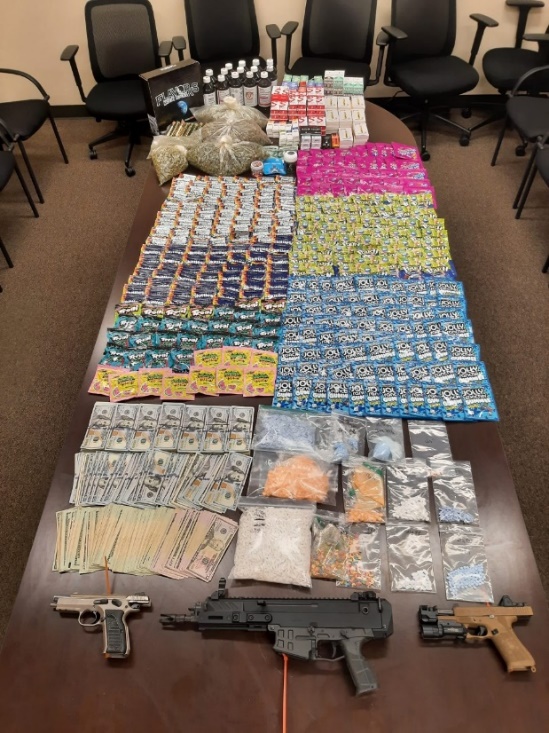 Photo of seized drugs, firearms and currency